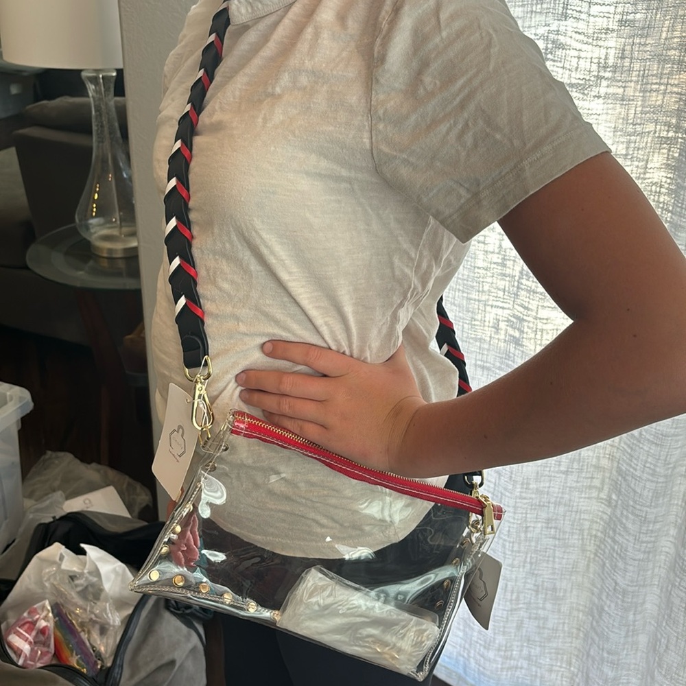 Clear bag with gorgeous red, white, and black strap.